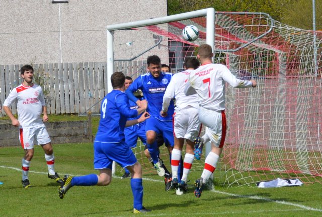 Cammy Marlow and Darren McGill head for goal