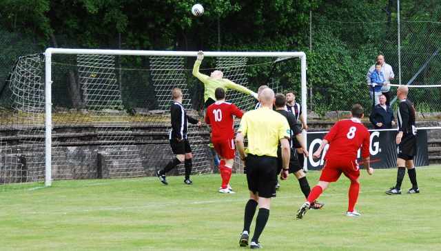 Ross Robertson heads for goal