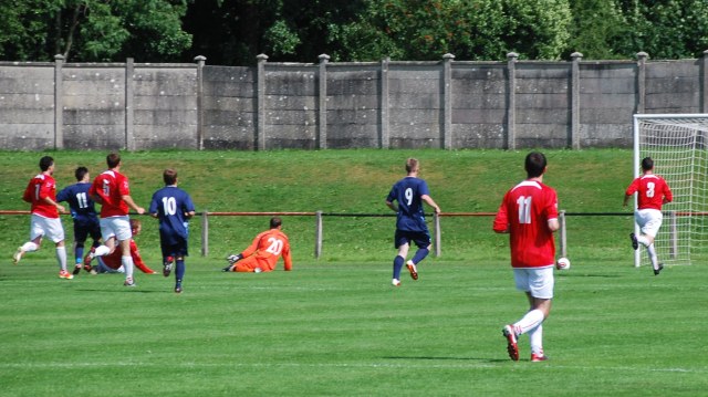 Lewis Sloan (11) slots home the equaliser