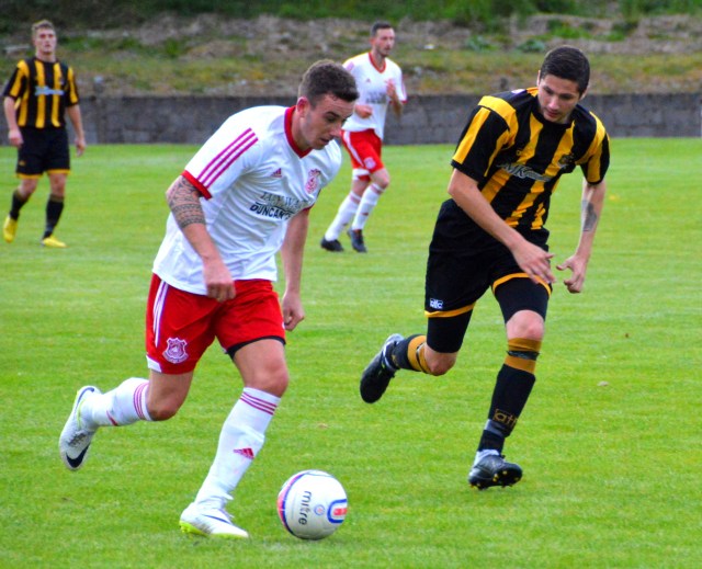 Daniel Orsi drives past Gordon Pope