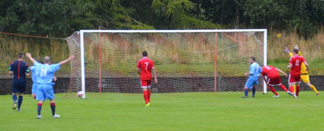 Ross Robertson (obscured) scores at the back post